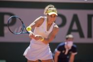 Pera plays a backhand in the French Open. - Source: Getty